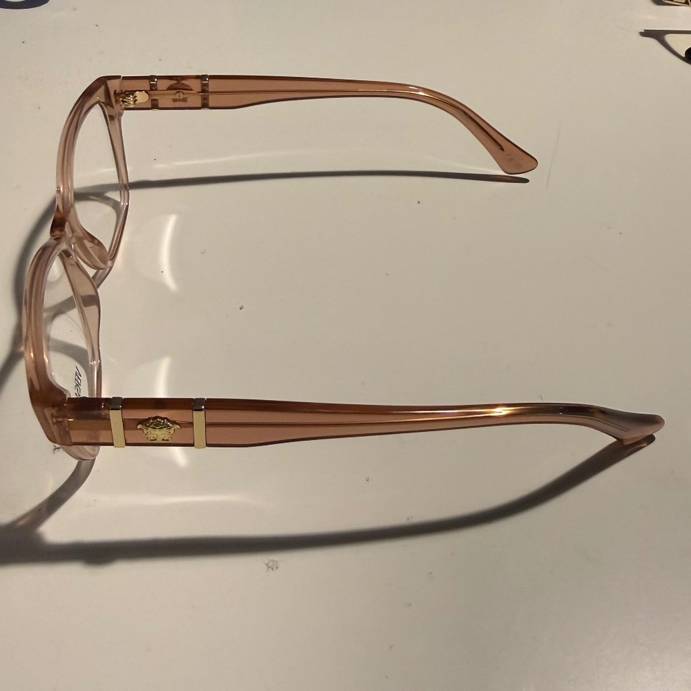 Versace Eyewear – Transparent Pink Frame with Gold Accents